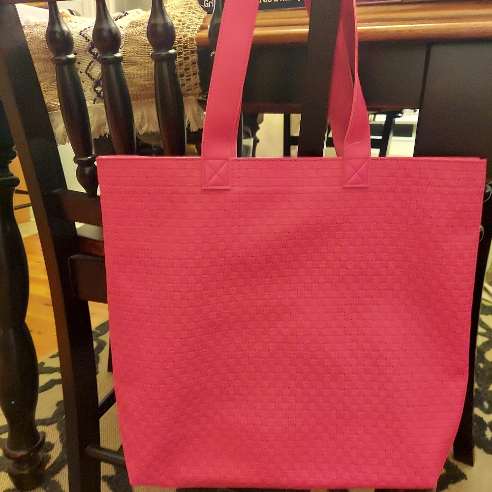 Bath and Body Works waffle style bag. Pink/orange in color NWT